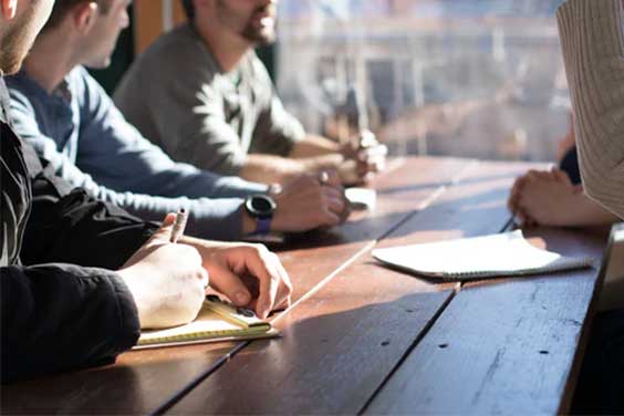 People discussing at a table