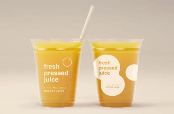 Plastic cups with yellow liquid inside
