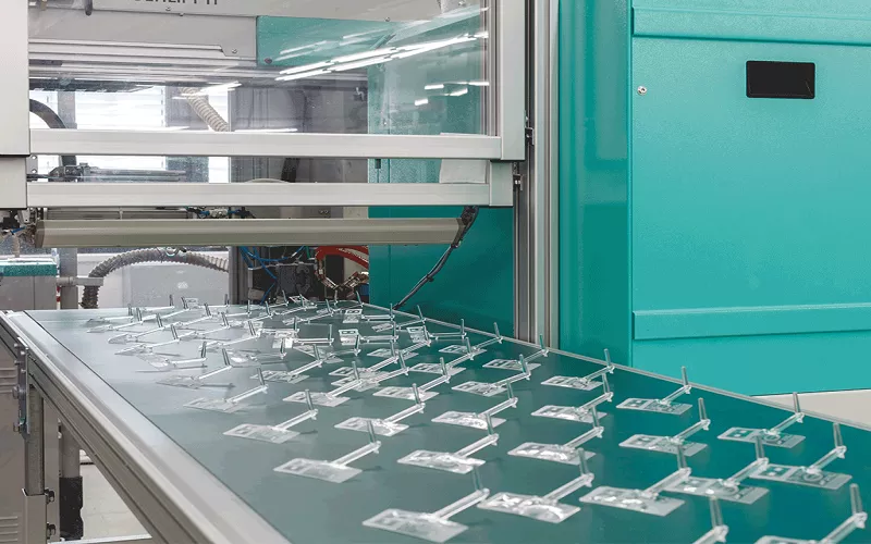 Injection molding production of acrylic plastic parts