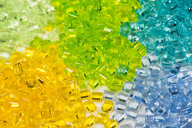 five different translucent polymer pellets for injection moulding